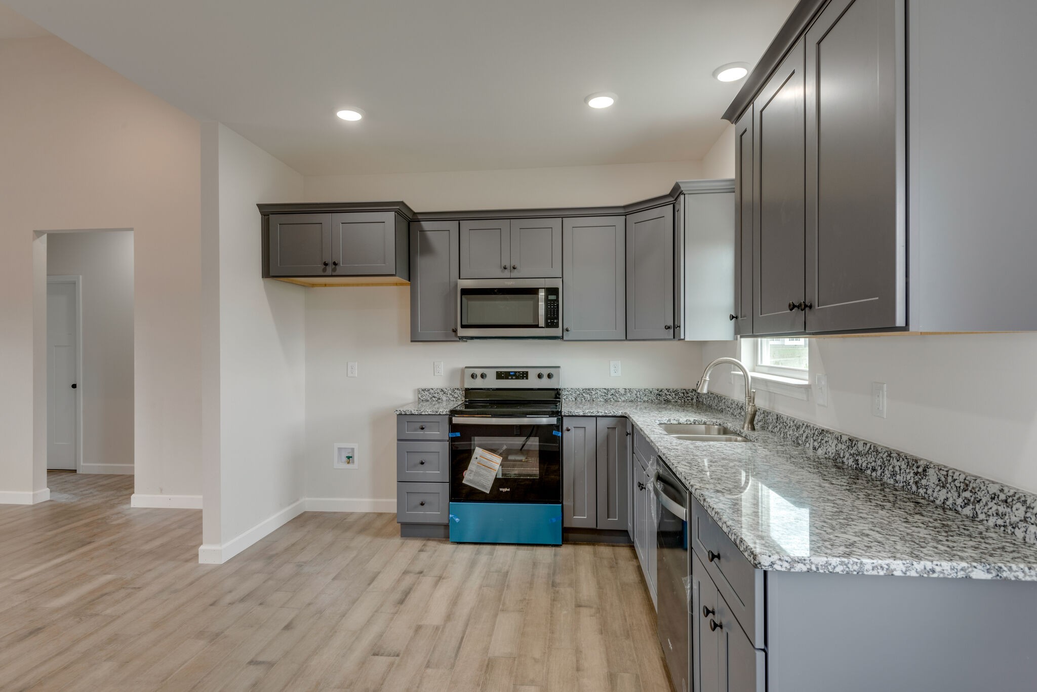 1224 Oak Grove Road Dickson, TN 37055 - Photo 10 of 28 a kitchen with granite countertop stainless steel appliances and wooden cabinets