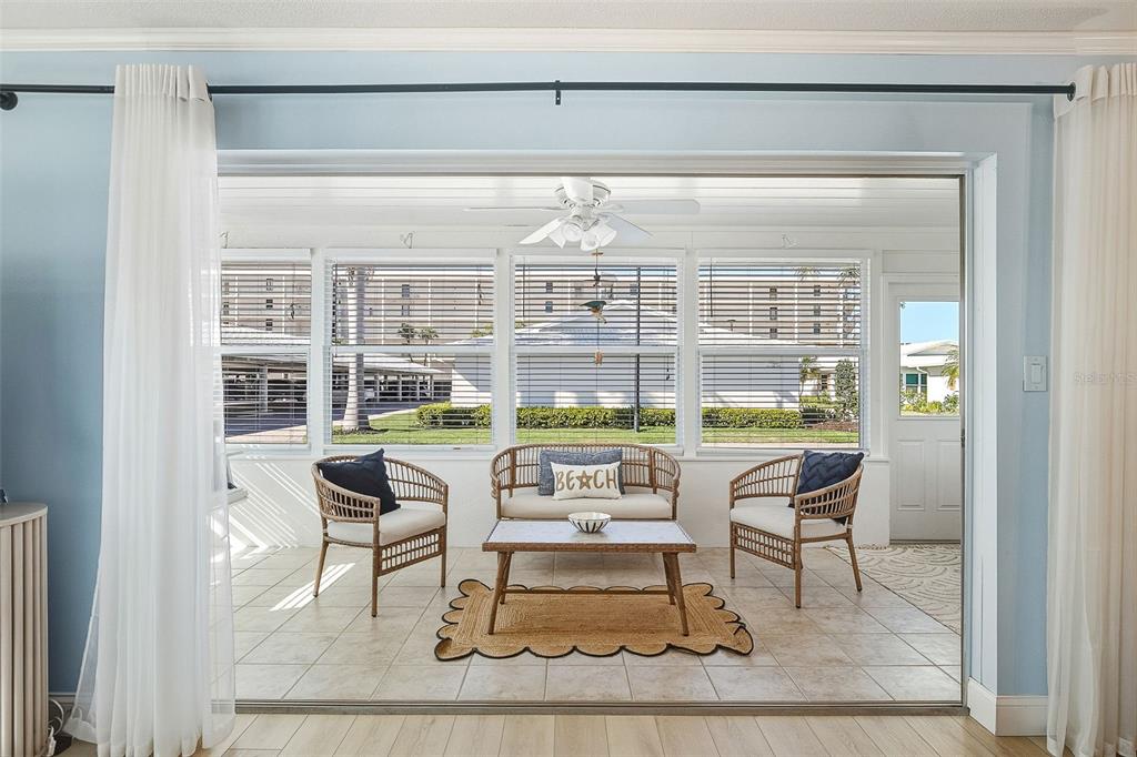 6300 Midnight Pass Road, Unit 21 Sarasota, FL 34242 - Photo 9 of 30 a balcony with table and chairs