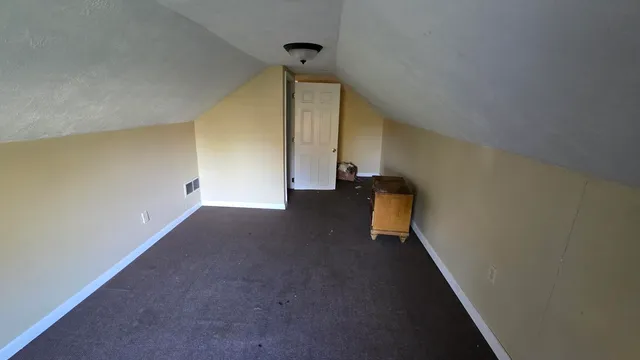 a view of a hallway with stairs