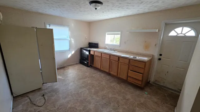 a room with windows and cabinet