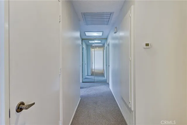 a bathroom with a sink a toilet a mirror a vanity and shower