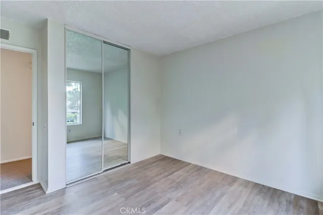an empty room with sliding glass door