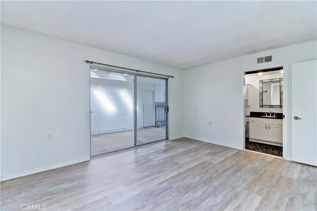 a bathroom with double vanity sinks and a mirror