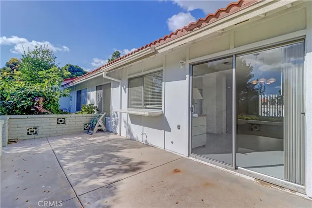a view of a house with a yard and a garden