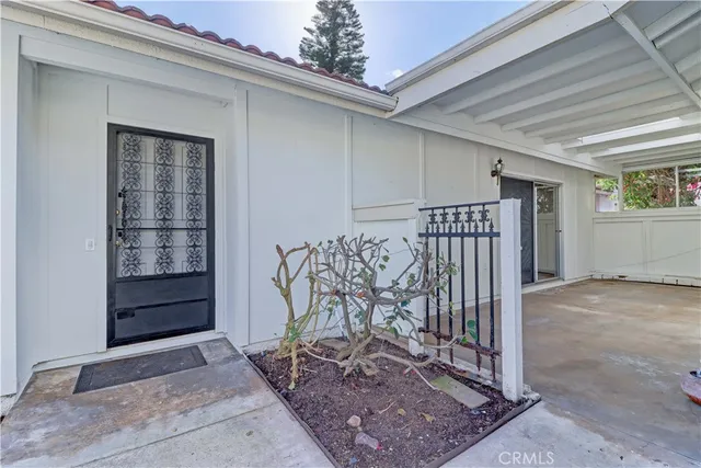 a view of a porch with a table and chair
