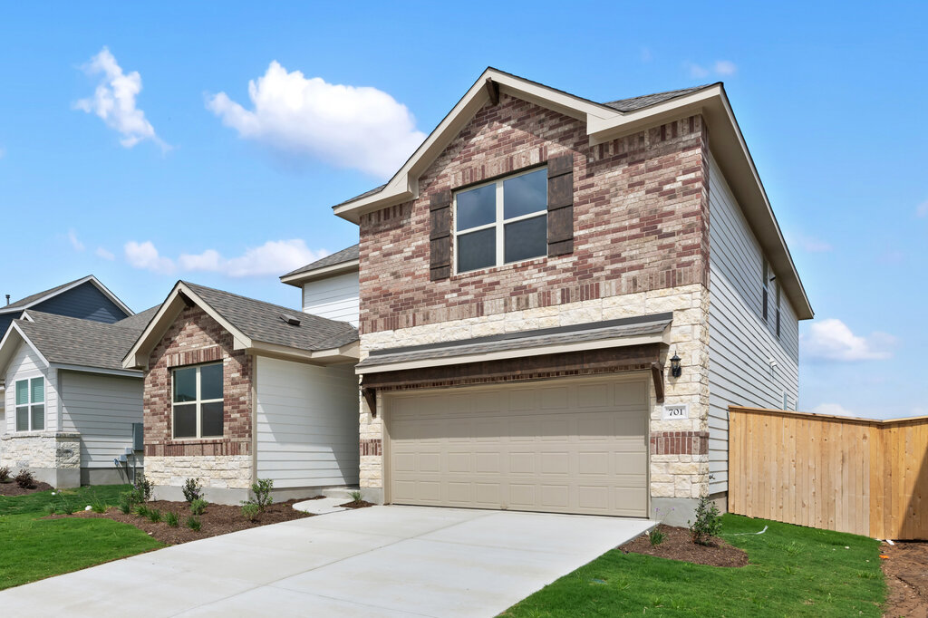 701 Henry Milton Road Georgetown, TX 78626 - Photo 2 of 40 a front view of a house with a yard