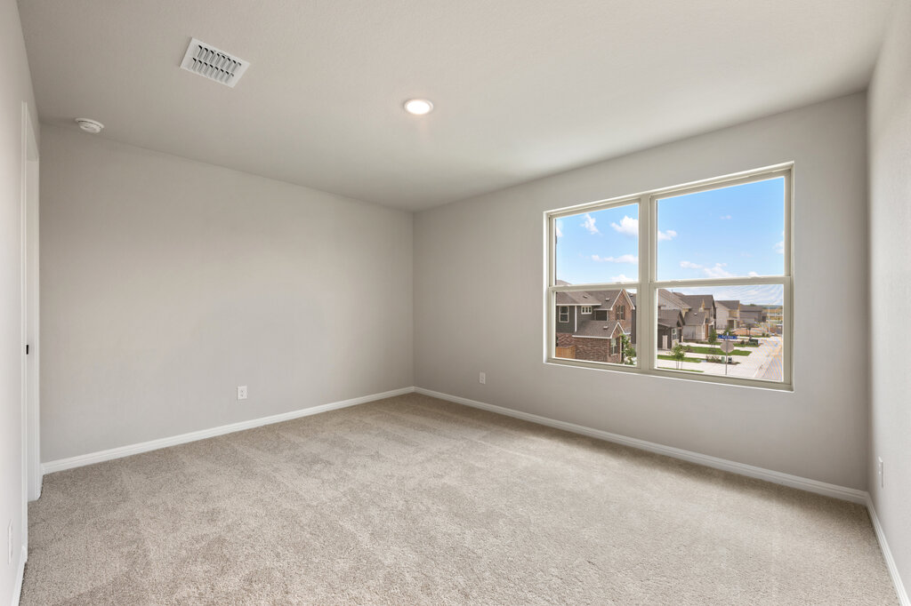 701 Henry Milton Road Georgetown, TX 78626 - Photo 32 of 40 an empty room with a window