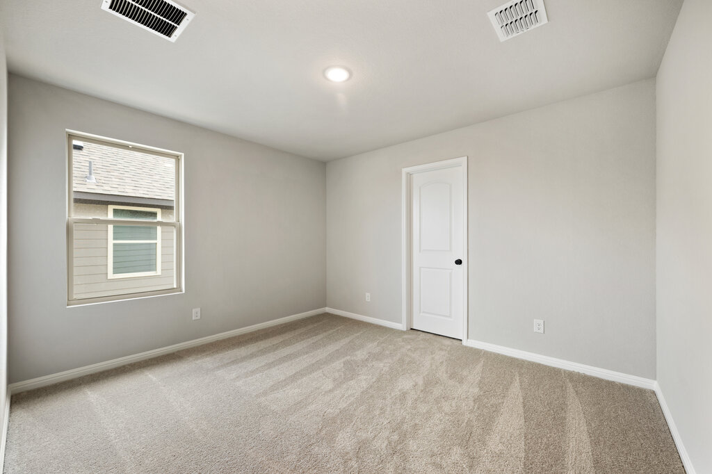 701 Henry Milton Road Georgetown, TX 78626 - Photo 34 of 40 an empty room with windows