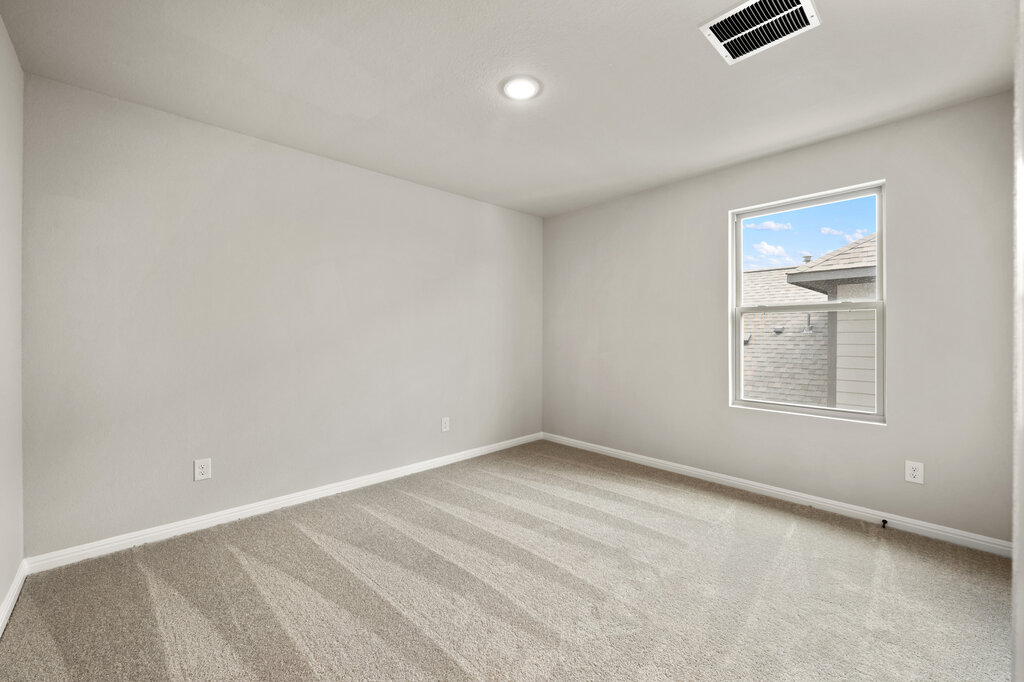 701 Henry Milton Road Georgetown, TX 78626 - Photo 35 of 40 an empty room with windows