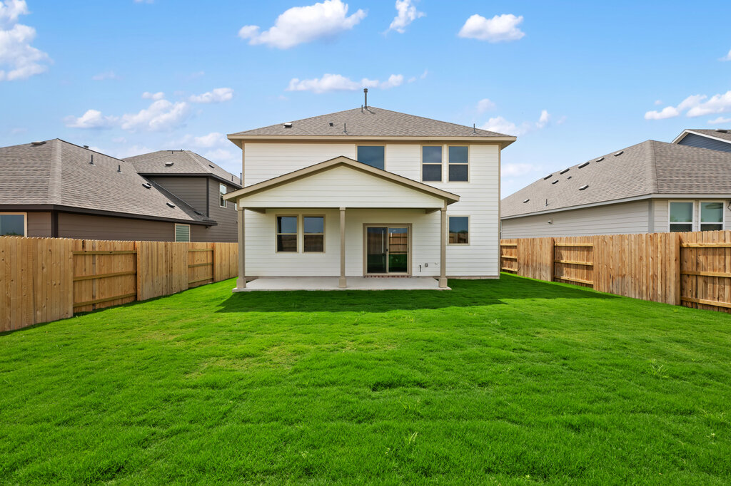 701 Henry Milton Road Georgetown, TX 78626 - Photo 39 of 40 a front view of a house with a garden