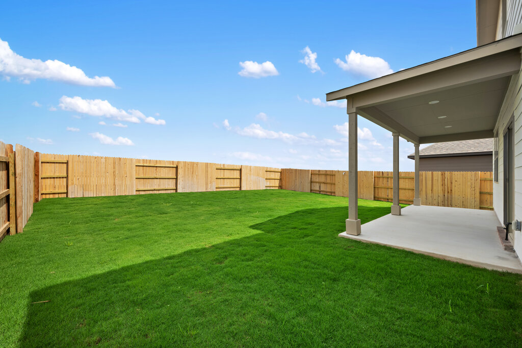 701 Henry Milton Road Georgetown, TX 78626 - Photo 40 of 40 a view of a backyard with table and chairs