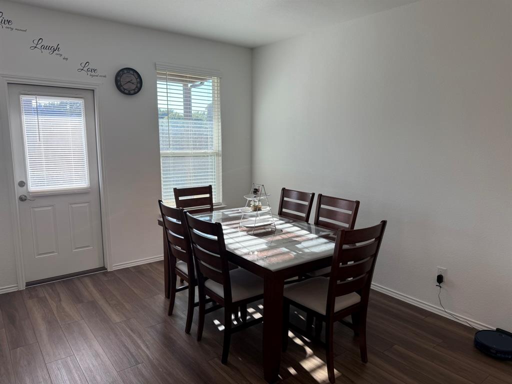 713 Agarita Way Princeton, TX 75407 - Photo 11 of 30 a view of a dining room with furniture and wooden floor
