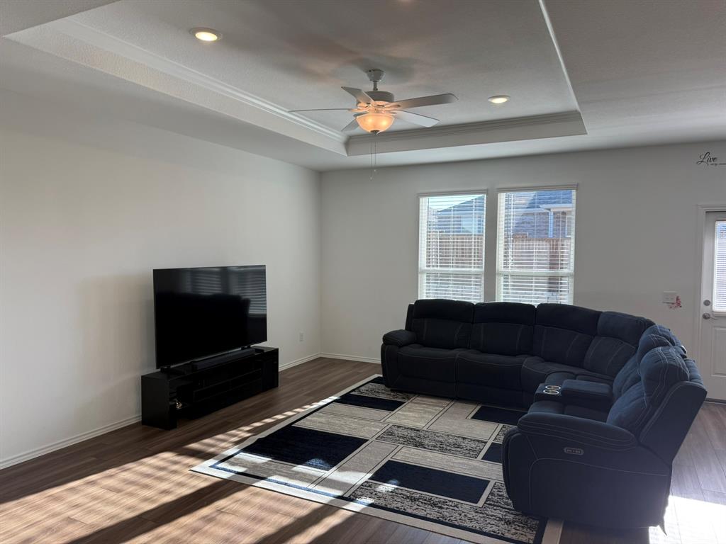 713 Agarita Way Princeton, TX 75407 - Photo 15 of 30 a living room with furniture and a flat screen tv