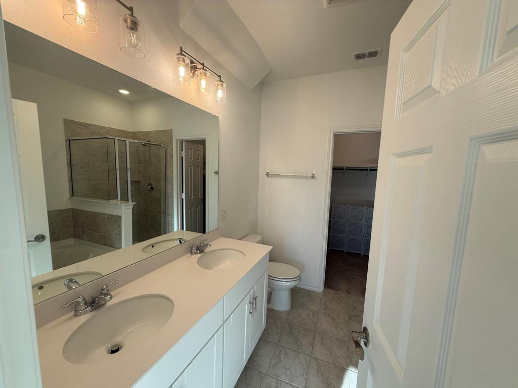 713 Agarita Way Princeton, TX 75407 - Photo 19 of 30 a bathroom with a sink and mirror