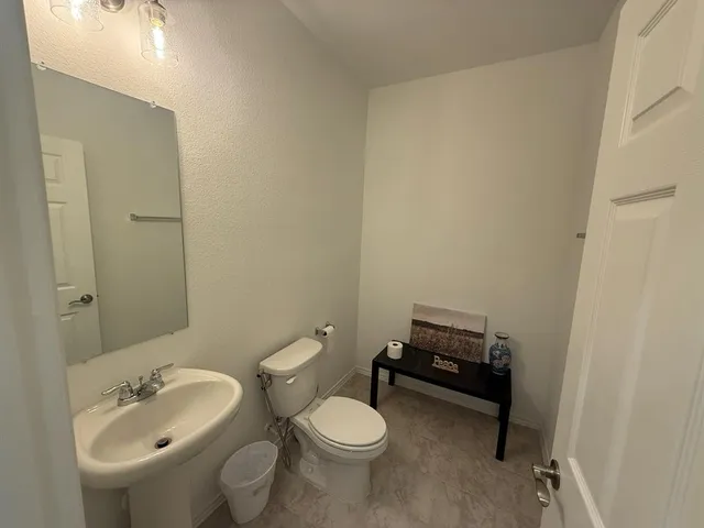 a bathroom with a sink and a toilet