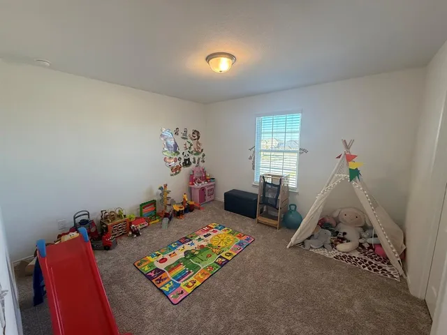 a room with furniture and a window