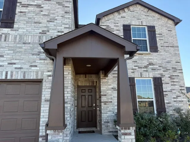 a front view of a house with garage