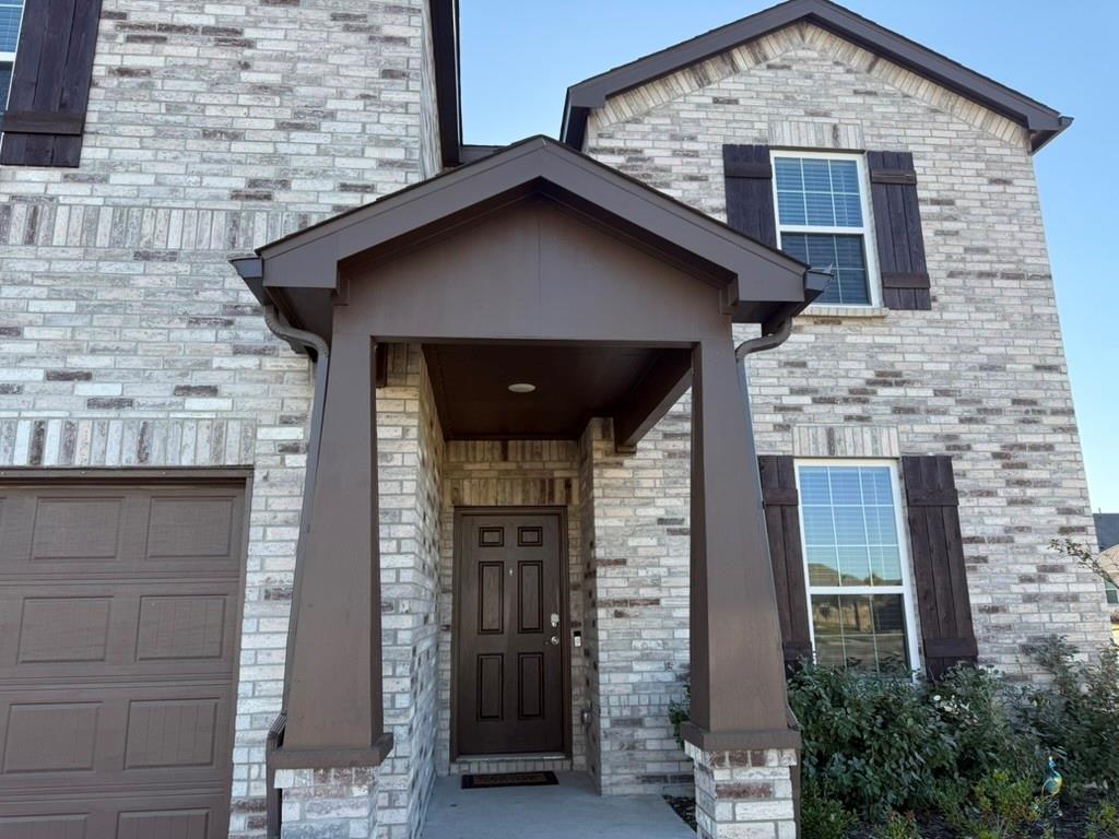 713 Agarita Way Princeton, TX 75407 - Photo 3 of 30 a front view of a house with garage