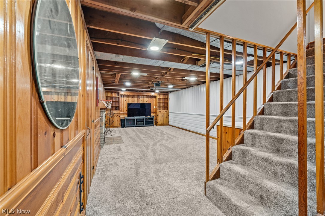 3137 West Edgerton Road Stow, OH 44224 - Photo 33 of 45 Basement with newer carpet floors and wood walls