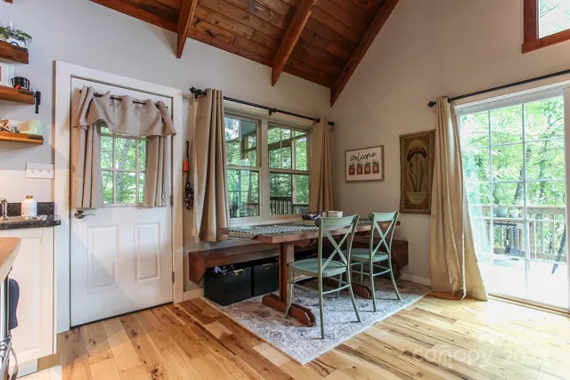 a dining room with furniture and window