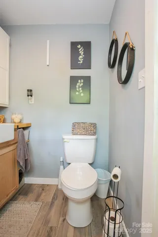 a room with a table chairs and a stove