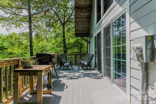 a view of a chair and table in the balcony
