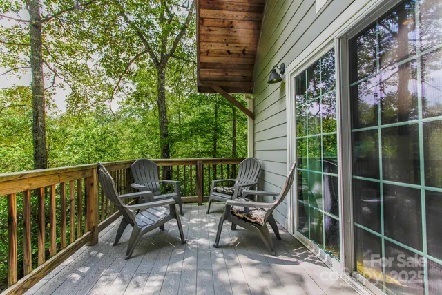 a view of a patio with a table and chairs