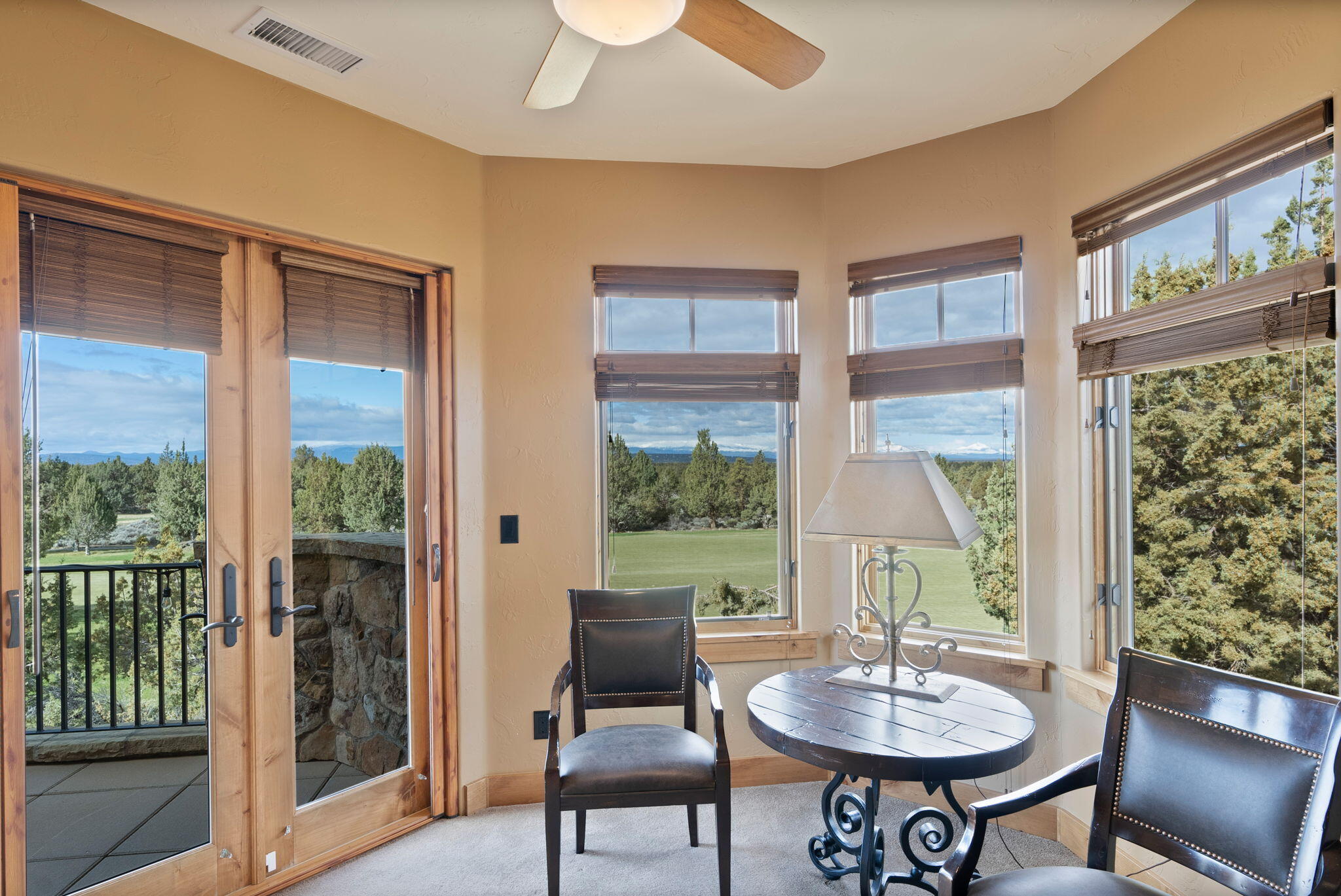 22887 Ghost Tree Lane Bend, OR 97701 - Photo 48 of 97 The stunning primary suite boasts a fireplace, sitting area, coffee bar, spa-like bath, private balcony & expansive views.
