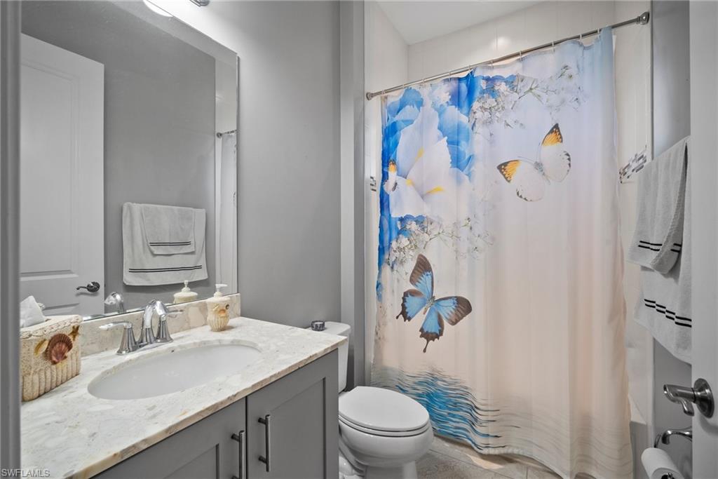 11404 Arezzo Way Fort Myers, FL 33913 - Photo 23 of 36 Bathroom featuring vanity and toilet