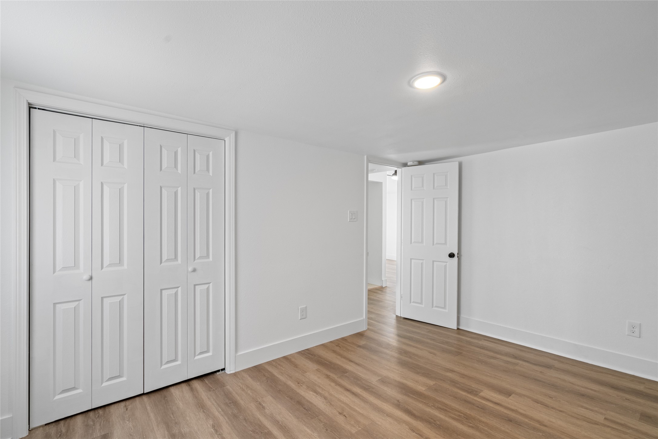 911 Knight Street, Unit D Houston, TX 77022 - Photo 11 of 11 a view of an empty room with wooden floor
