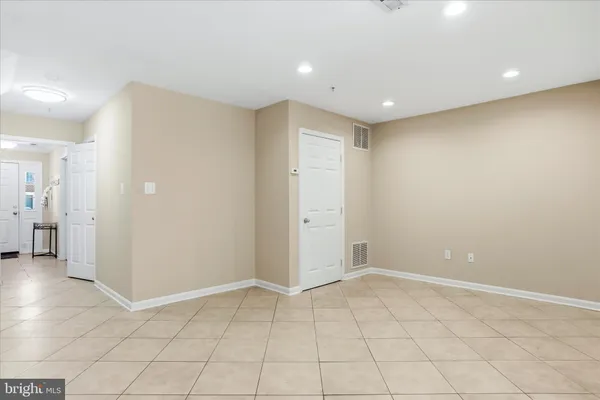 an empty room with an entrance and door