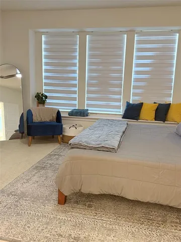 a living room with a couch and a window