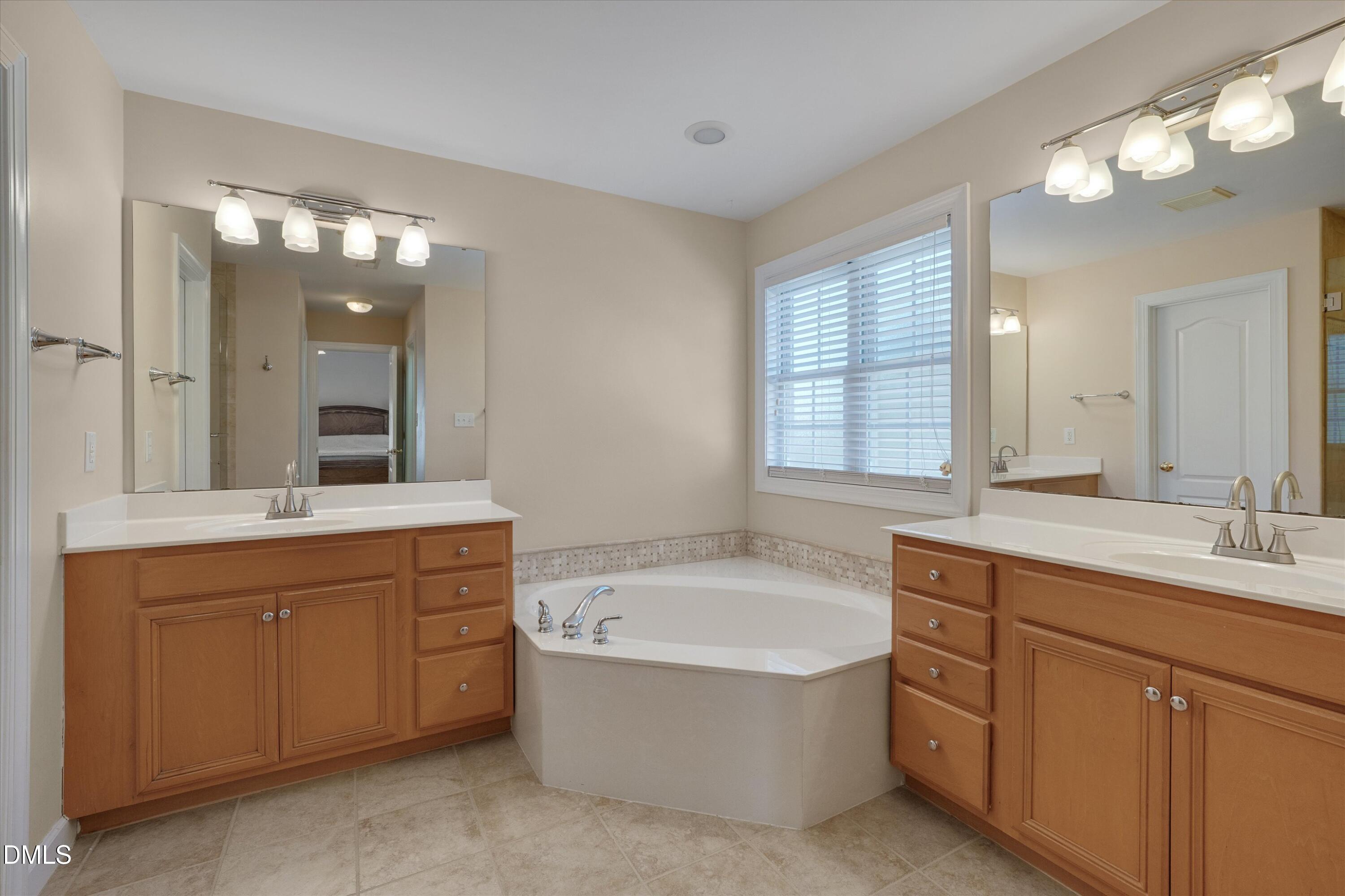 112 Beckford Road Cary, NC 27518 - Photo 34 of 55 Primary Bathroom with garden tub and double vanities