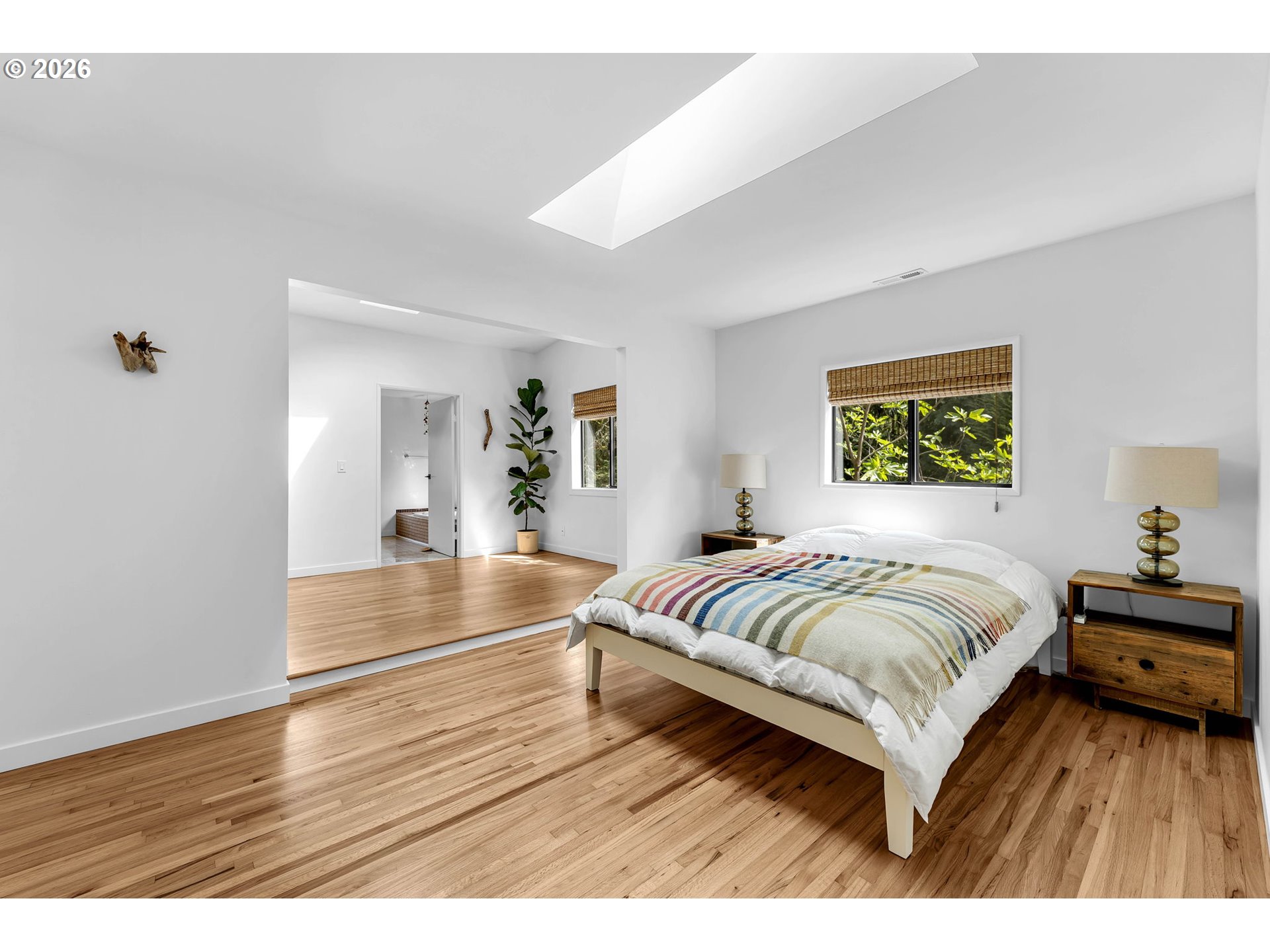 29909 Northwest 51st Avenue Ridgefield, WA 98642 - Photo 12 of 48 a spacious bedroom with a bed and a large window
