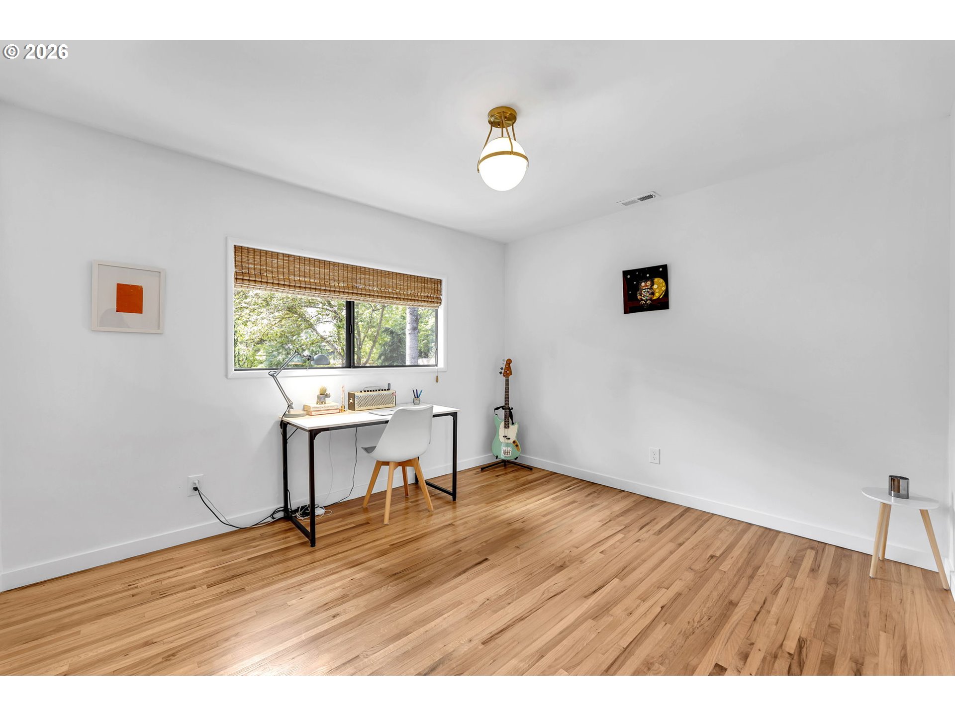 29909 Northwest 51st Avenue Ridgefield, WA 98642 - Photo 17 of 48 a view of an empty room with a window and wooden floor