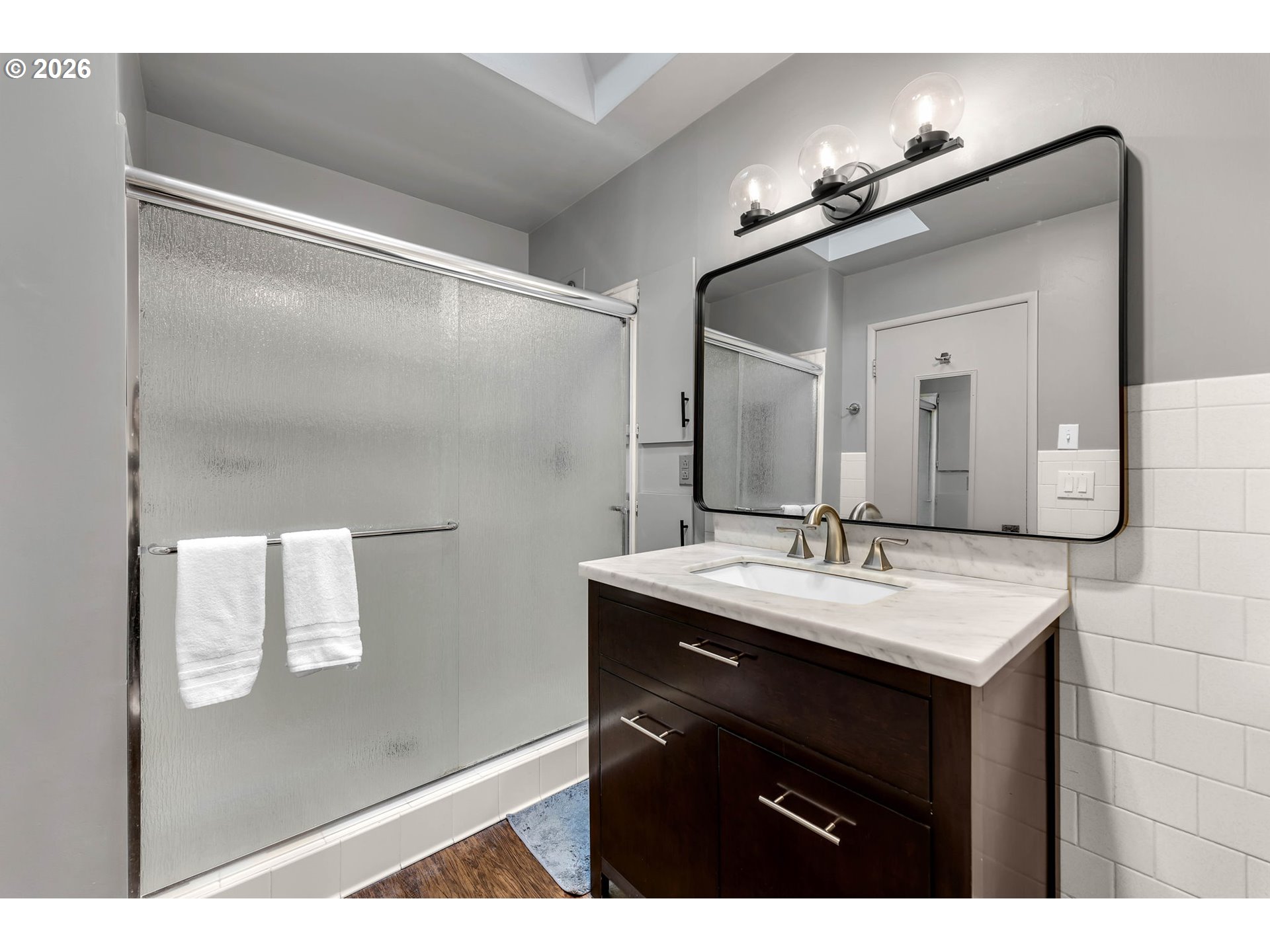 29909 Northwest 51st Avenue Ridgefield, WA 98642 - Photo 18 of 48 a bathroom with a sink vanity and a mirror