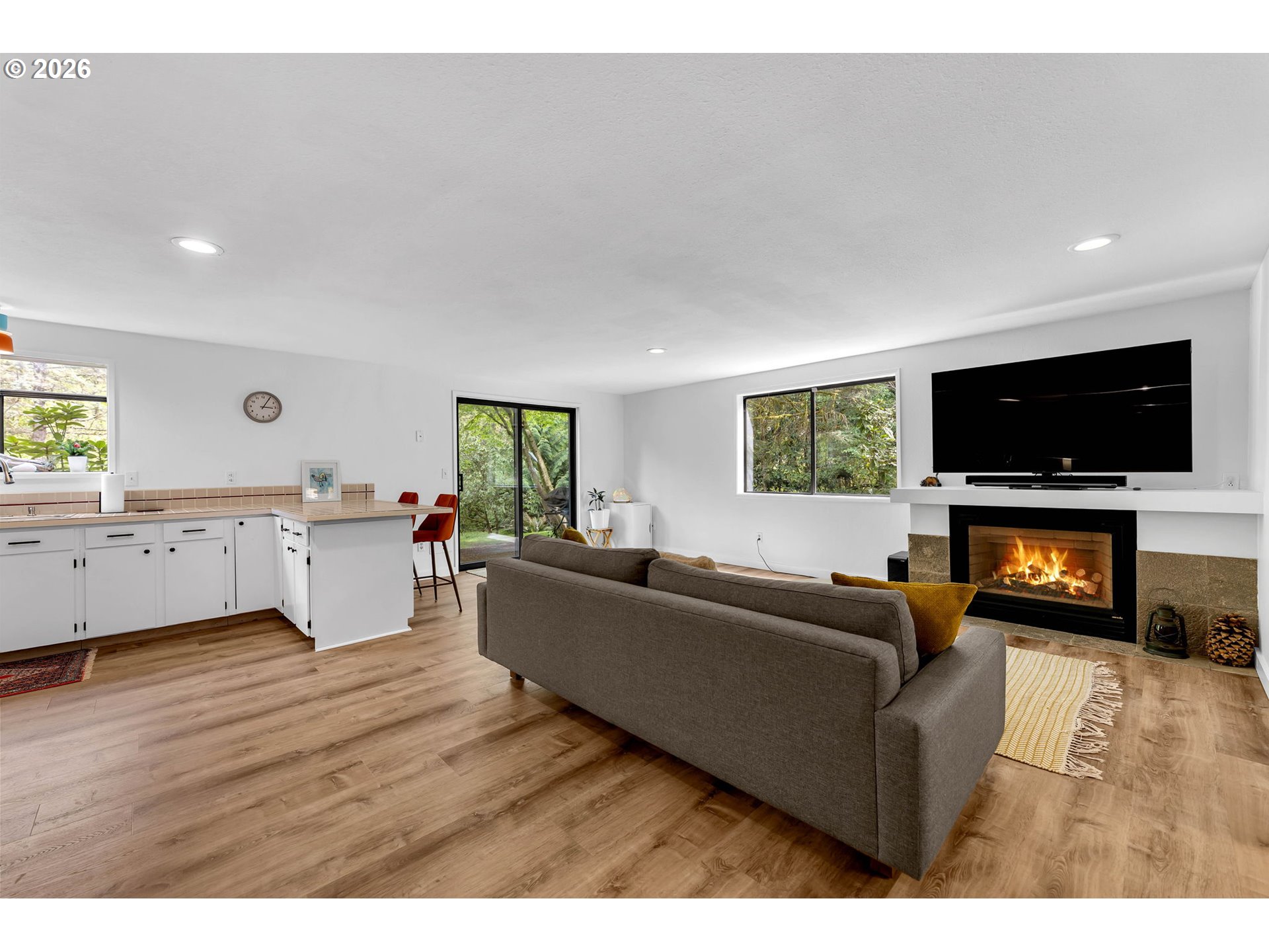 29909 Northwest 51st Avenue Ridgefield, WA 98642 - Photo 19 of 48 a living room with furniture and a flat screen tv