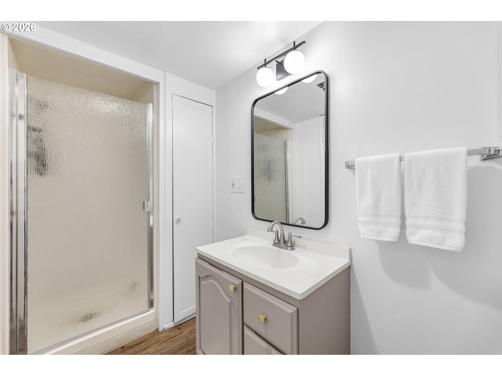 29909 Northwest 51st Avenue Ridgefield, WA 98642 - Photo 28 of 48 a bathroom with a sink vanity and mirror