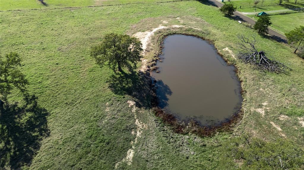 0 Cr-4059 Kemp, TX 75143 - Photo 17 of 21 an aerial view of a house with a yard and large trees