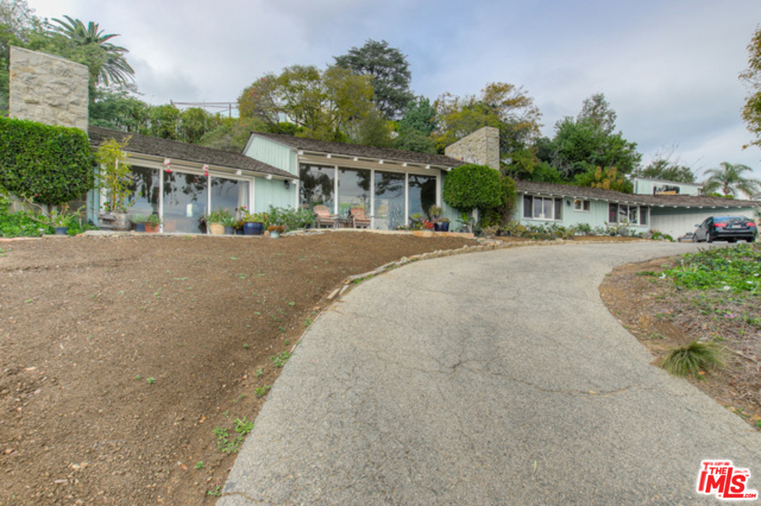 397 Fordyce Road Los Angeles, CA 90049 - Photo 4 of 9 front view of a house with a street