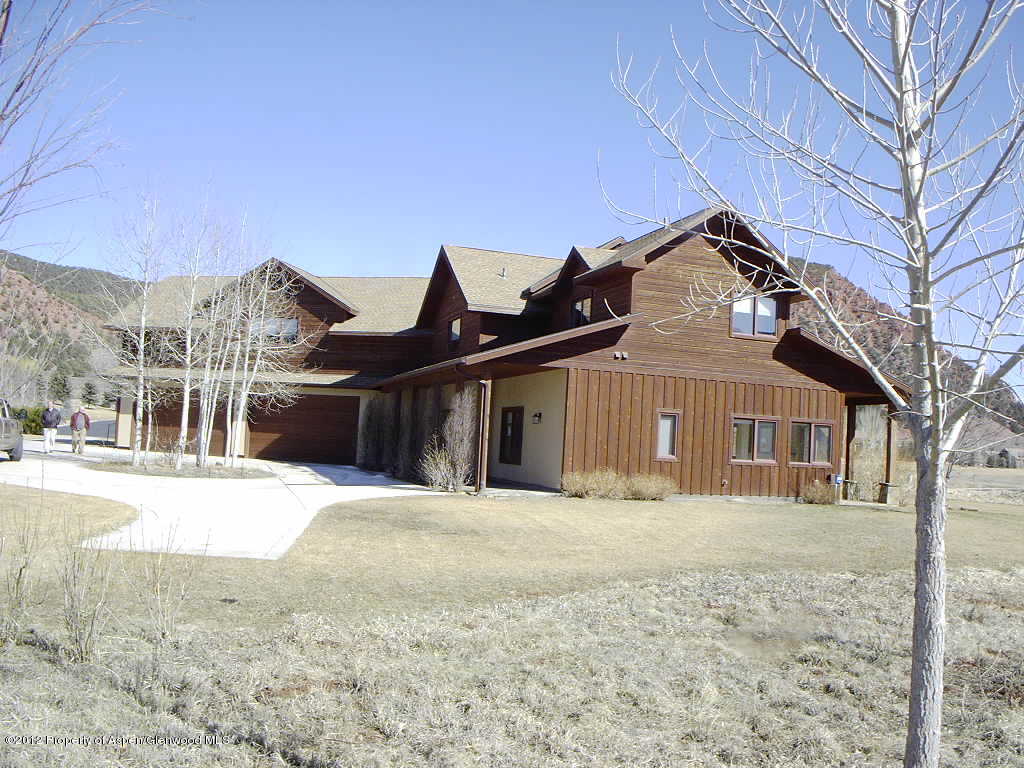 463 Diamond A Ranch Road Carbondale, CO 81623 - Photo 3 of 10 a front view of a house with a yard covered in snow