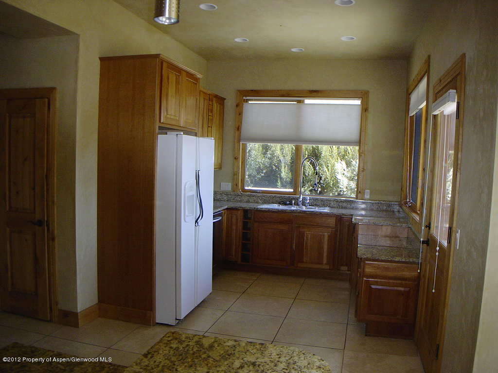 463 Diamond A Ranch Road Carbondale, CO 81623 - Photo 5 of 10 a kitchen with a refrigerator and washer