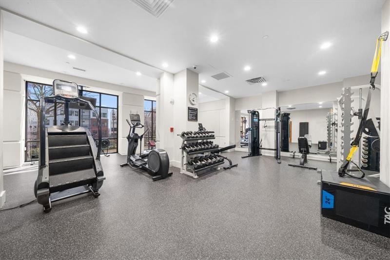 3475 Oak Valley Road Northeast, Unit 410 Atlanta, GA 30326 - Photo 29 of 36 a view of a room with gym equipment
