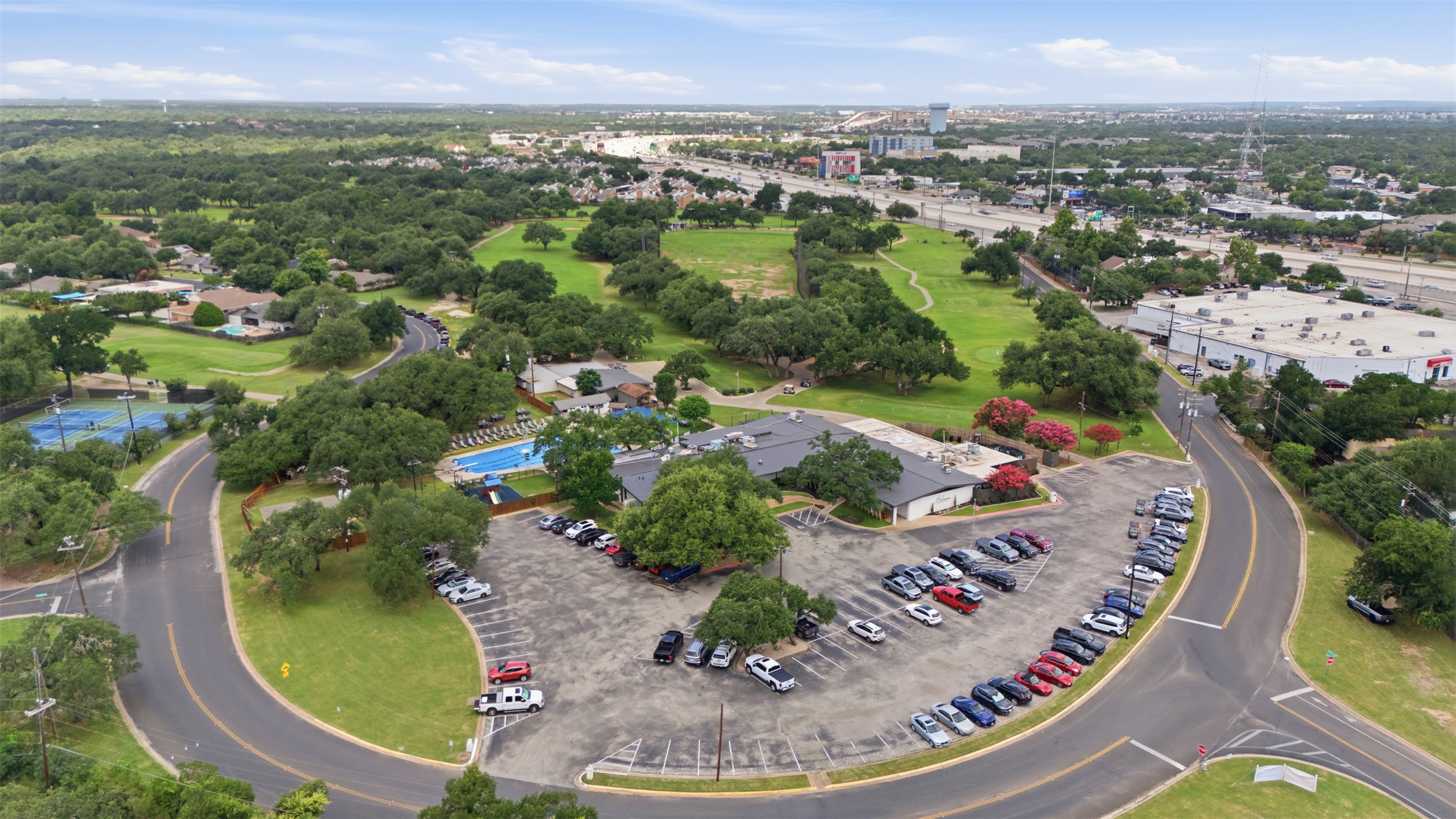 11611 Rustic Rock Drive, Unit B Austin, TX 78750 - Photo 28 of 30 An aerial perspective reveals a vibrant community with recreational amenities and lush green spaces.