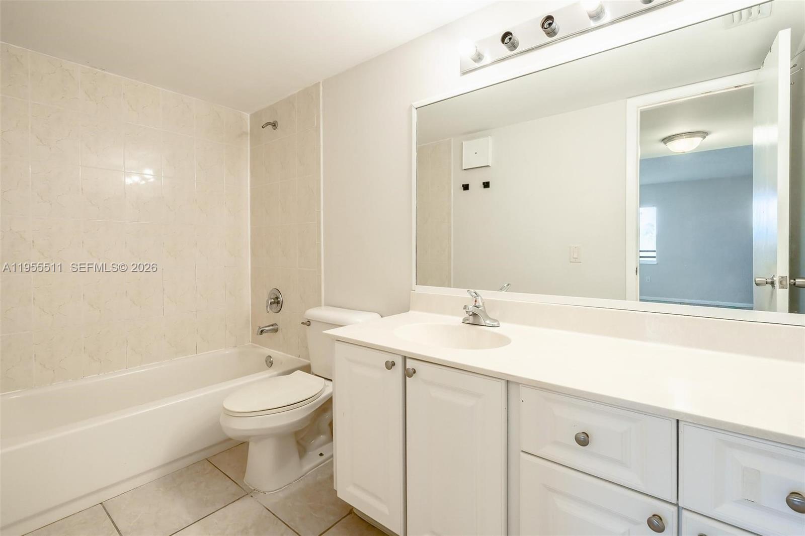 711 North Pine Island Road, Unit 410 Plantation, FL 33324 - Photo 16 of 45 a bathroom with a sink a toilet and shower
