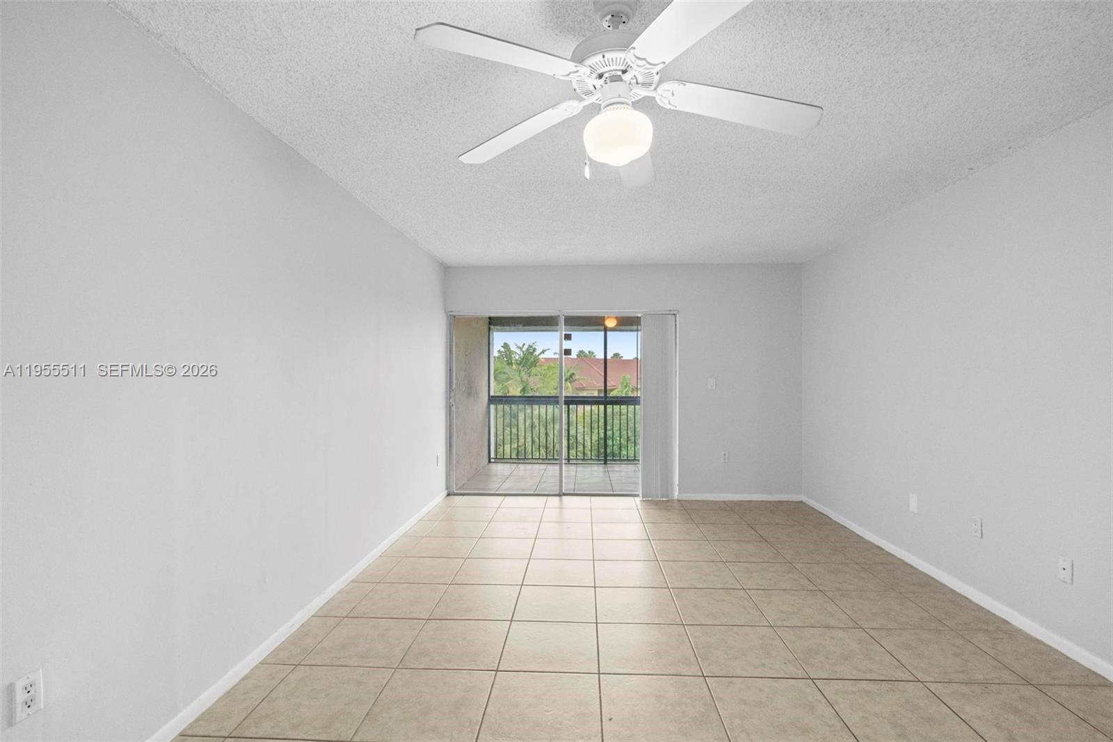 711 North Pine Island Road, Unit 410 Plantation, FL 33324 - Photo 18 of 45 an empty room with windows and fan