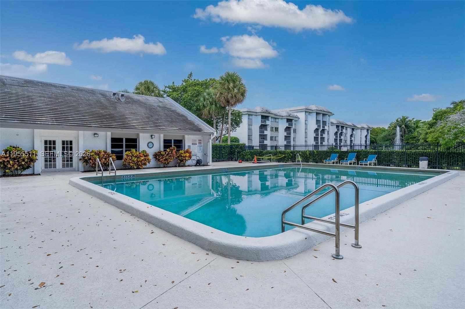 711 North Pine Island Road, Unit 410 Plantation, FL 33324 - Photo 34 of 45 a view of swimming pool with outdoor seating