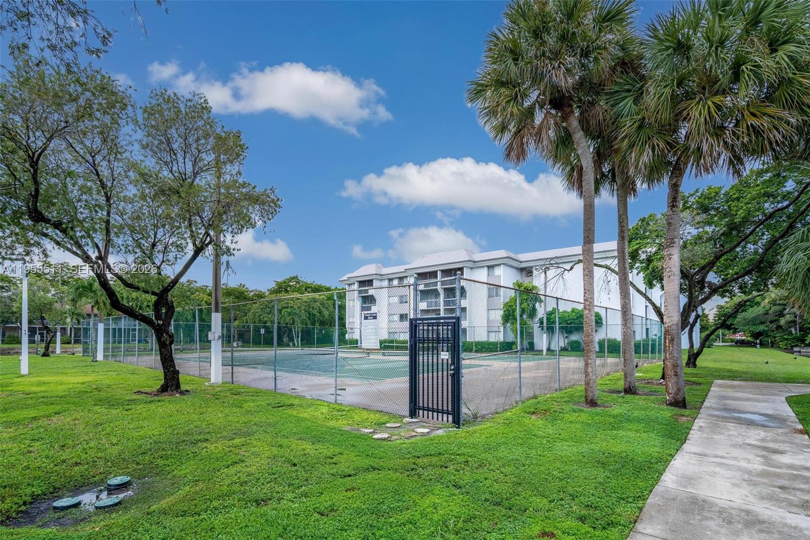 711 North Pine Island Road, Unit 410 Plantation, FL 33324 - Photo 35 of 45 a view of a park with large trees