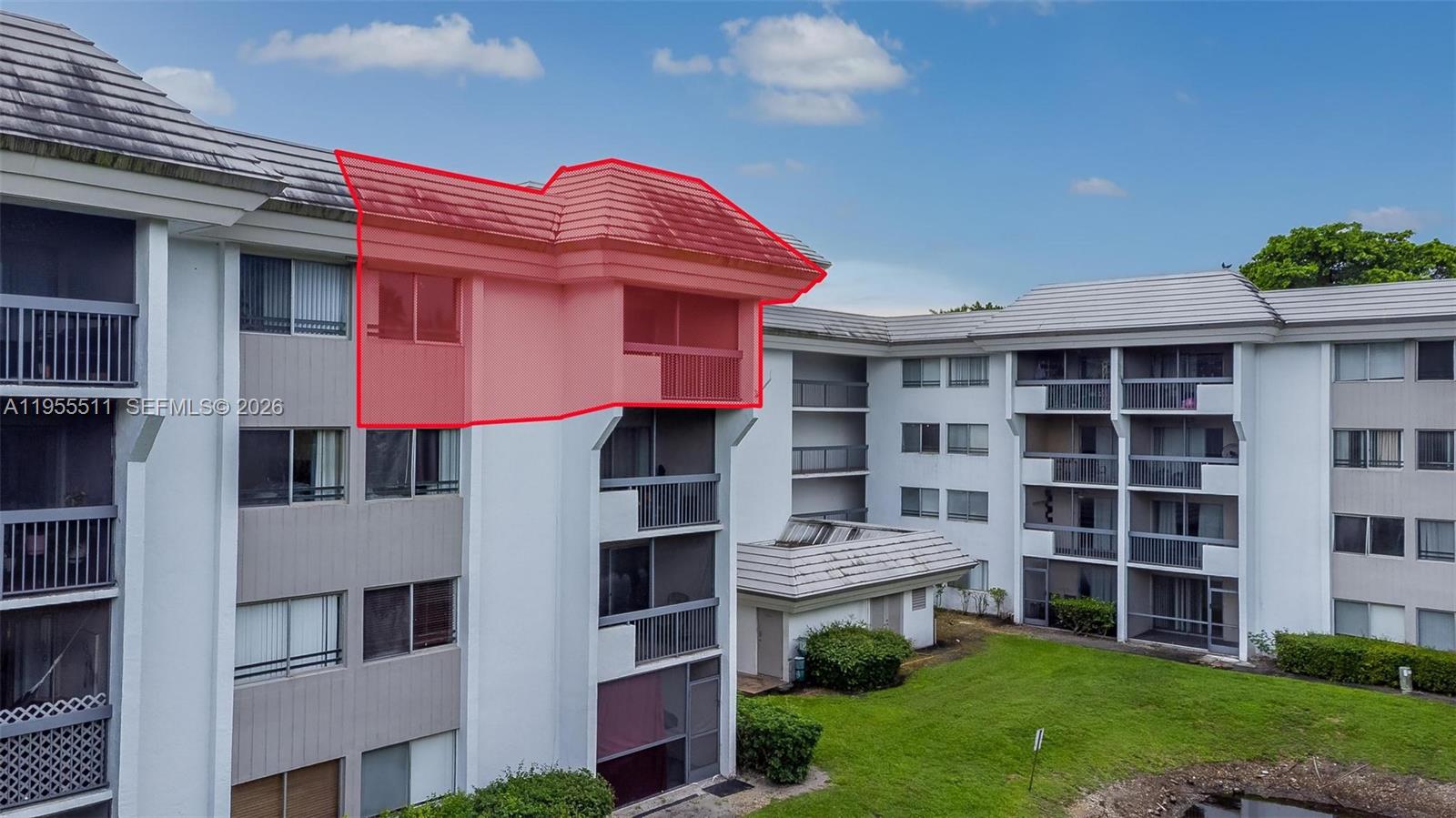 711 North Pine Island Road, Unit 410 Plantation, FL 33324 - Photo 44 of 45 a front view of a building with a garden