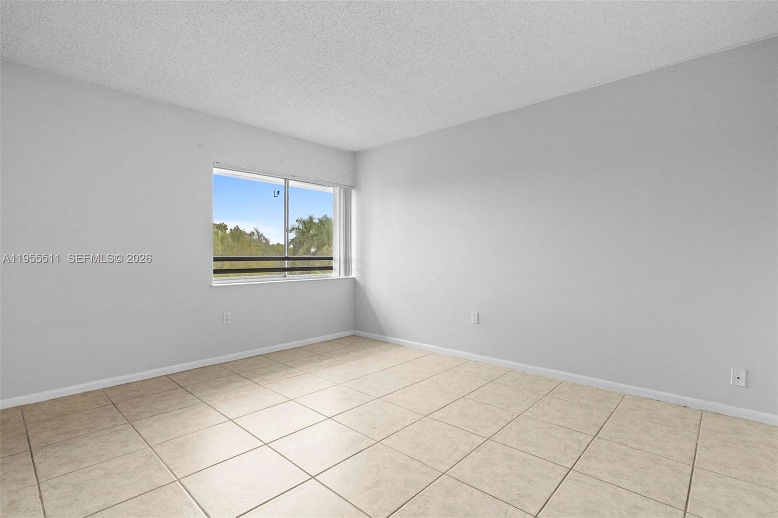 711 North Pine Island Road, Unit 410 Plantation, FL 33324 - Photo 7 of 45 a view of an empty room and window